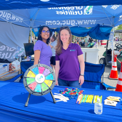GUC employees giving away SWAG at Pirate Fest