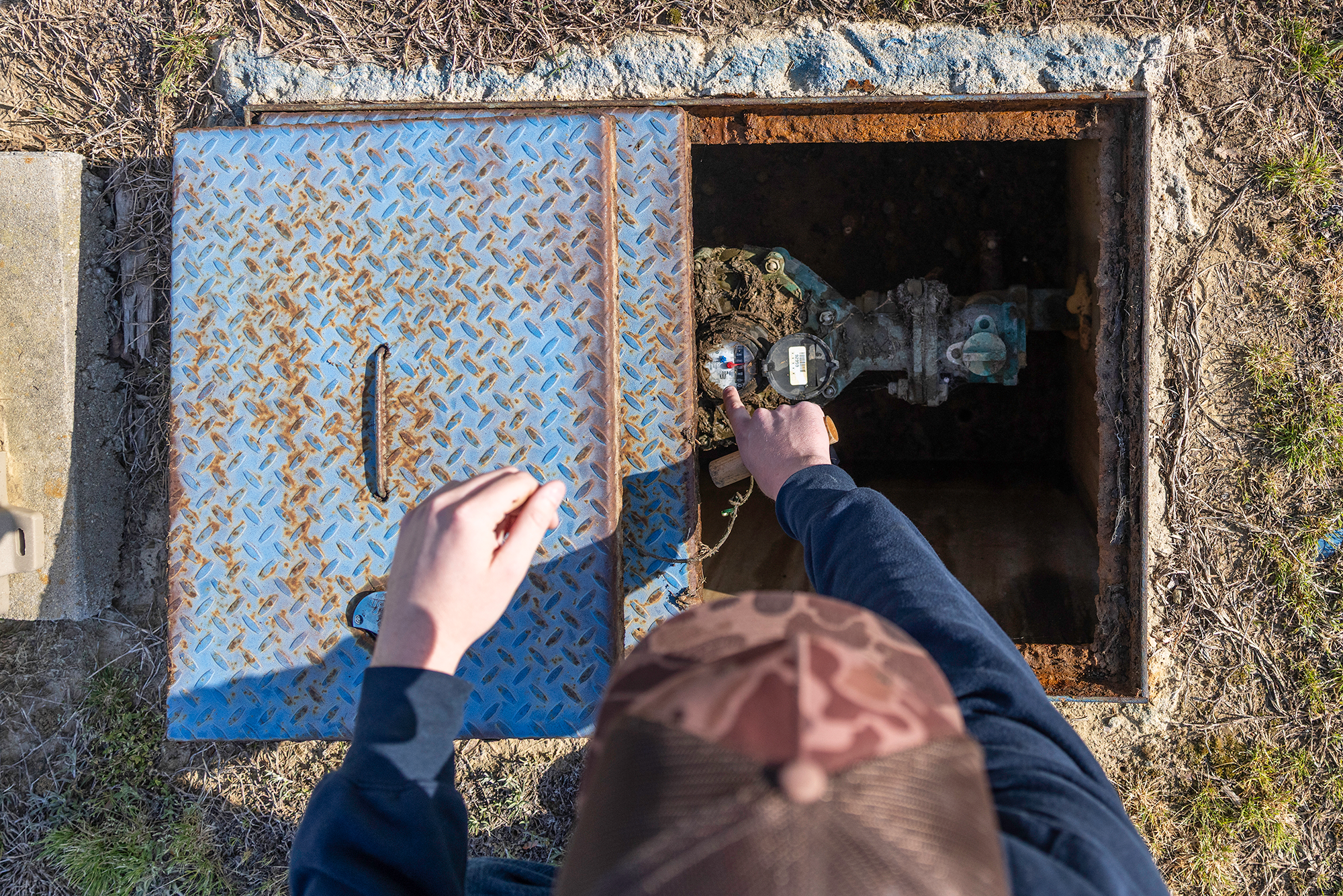 Metere technician reading a water meter