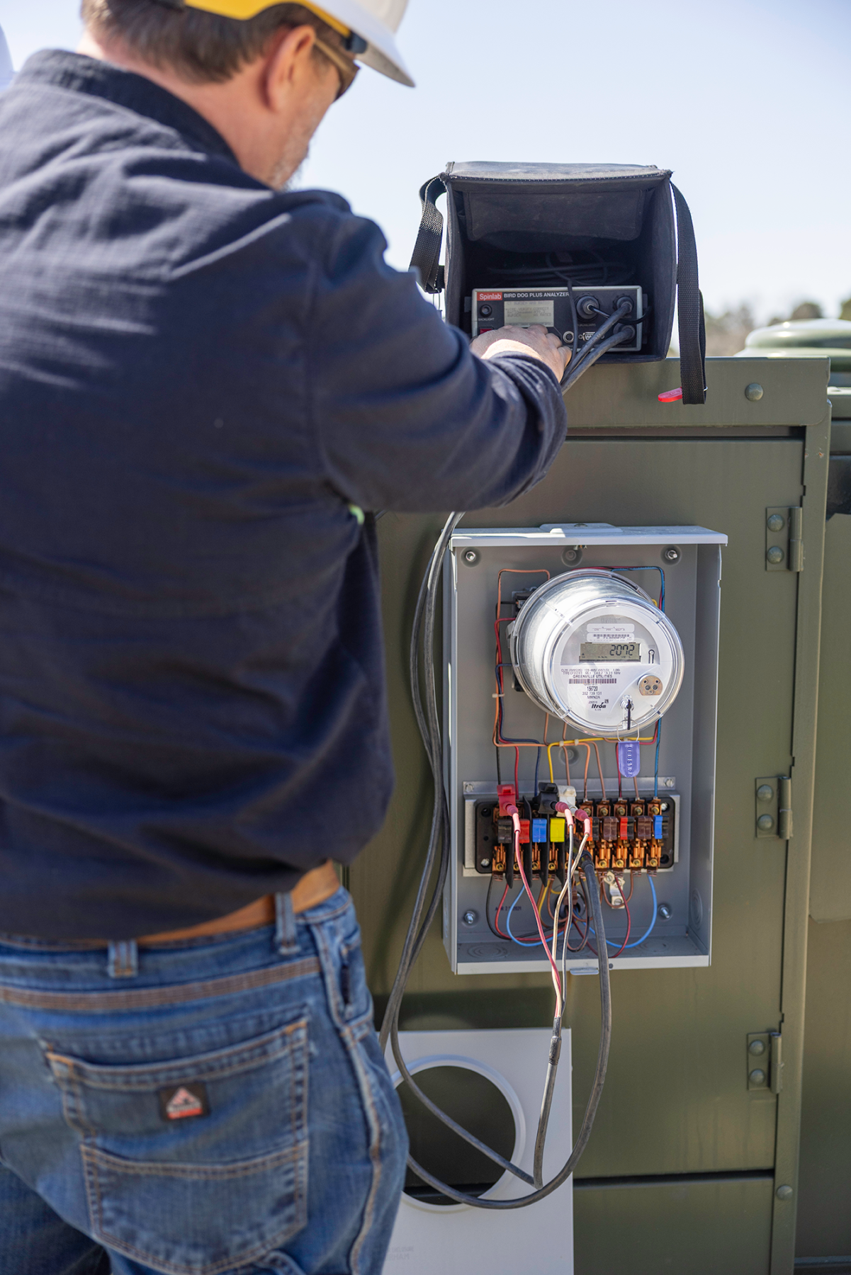 Meter technician tests commercial meter