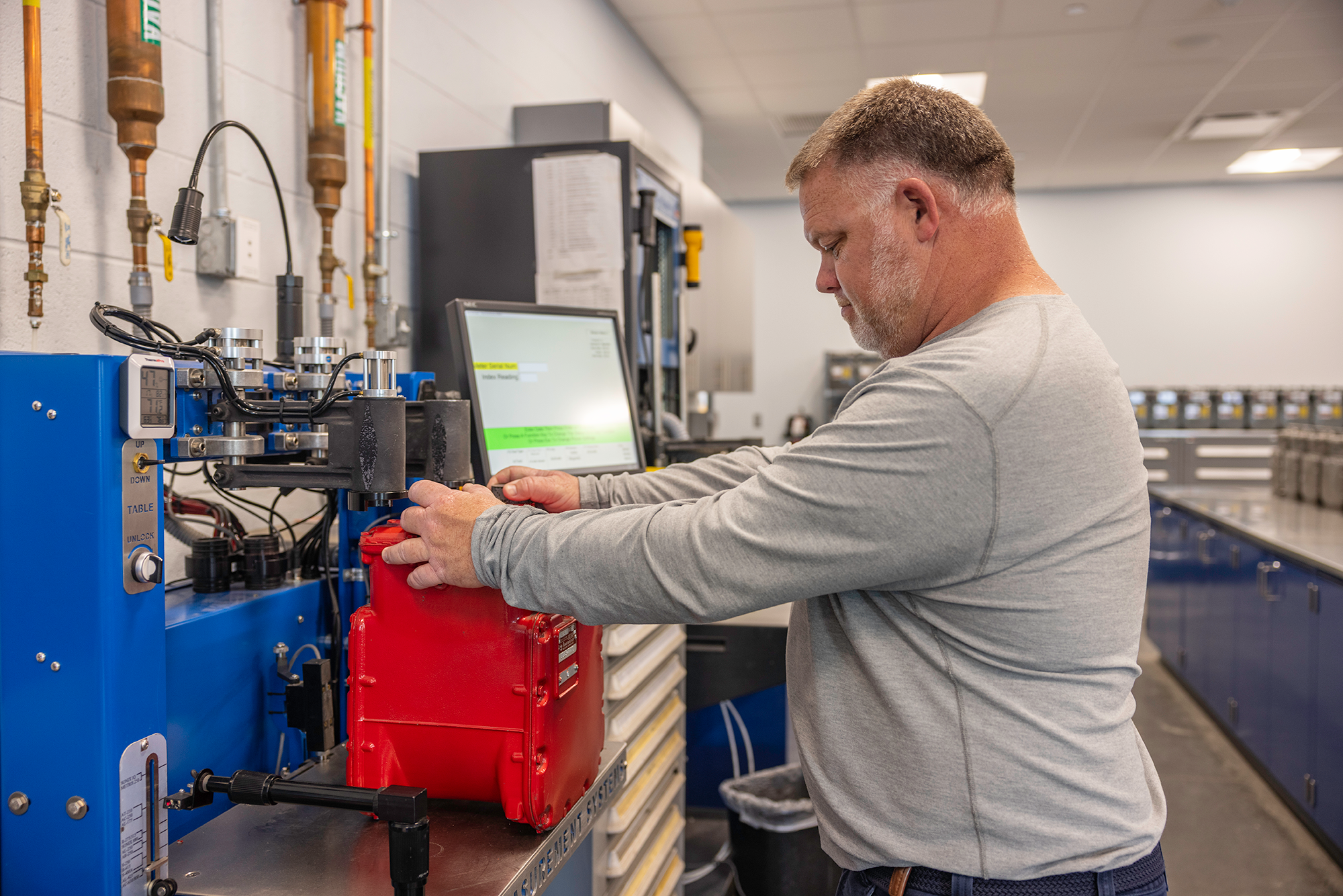 Meter techincian tests gas meter