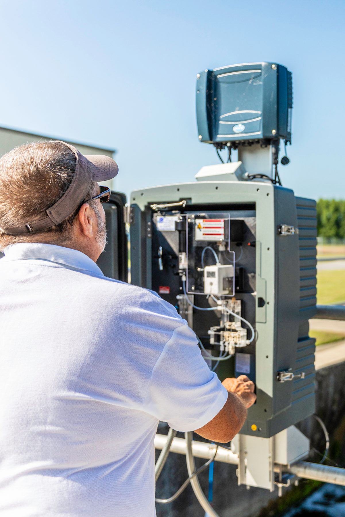 WWTP Operator III Steve Hedgepeth checks the clearwell phosphorus analyzer to ensure proper operation.