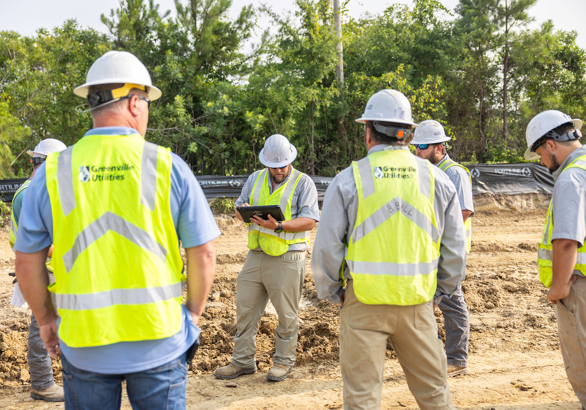 WR Systems O/M Crew Leader I Josh Setzer holds a Job Safety Briefing before the crew installs a water main.