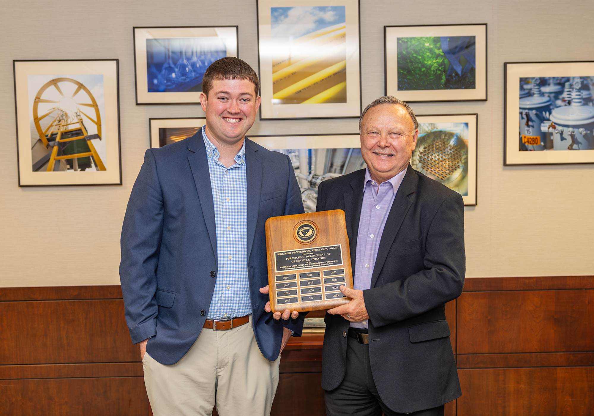 Will James and Cleve Haddock holding an award.