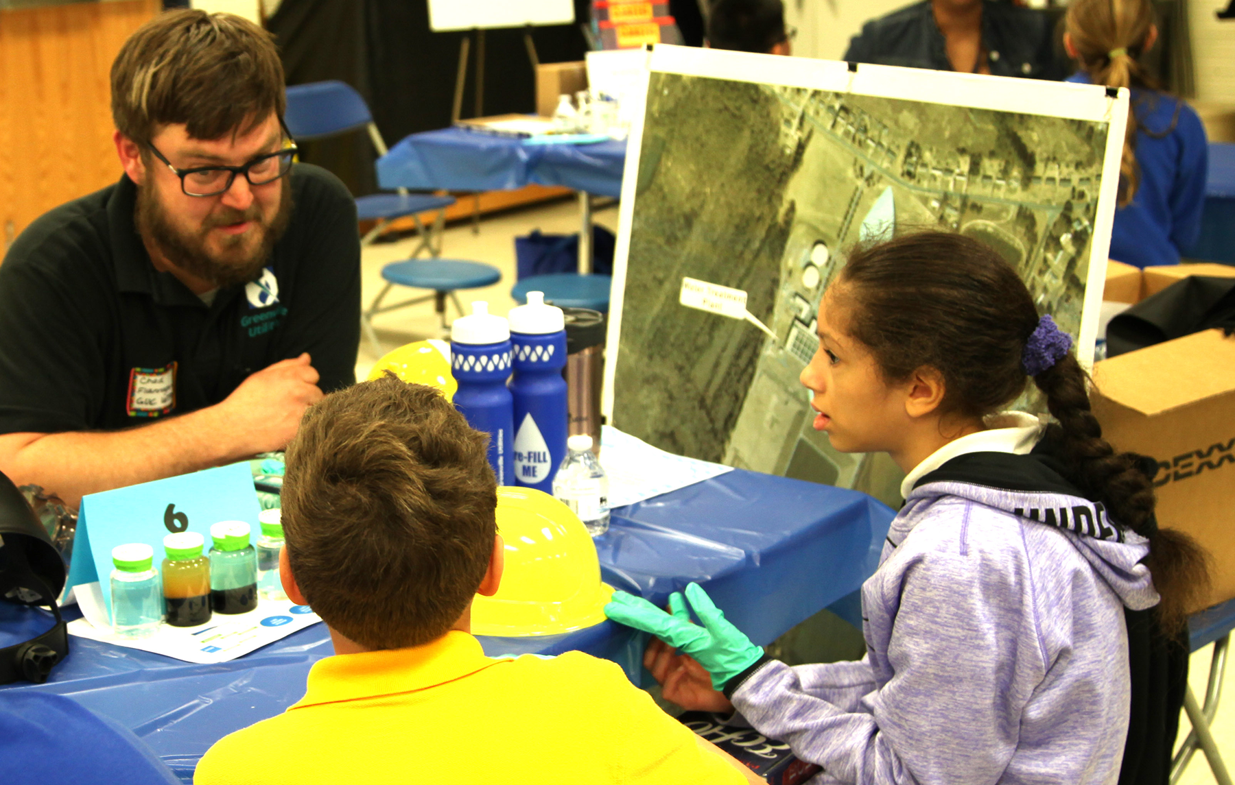 Chad Flannagan (Water) speaks with Students at Elmhurst
